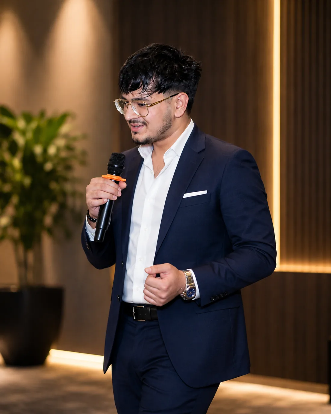 Rishit Bansal, President 2026–27, speaking into a microphone at an RCCS event.
